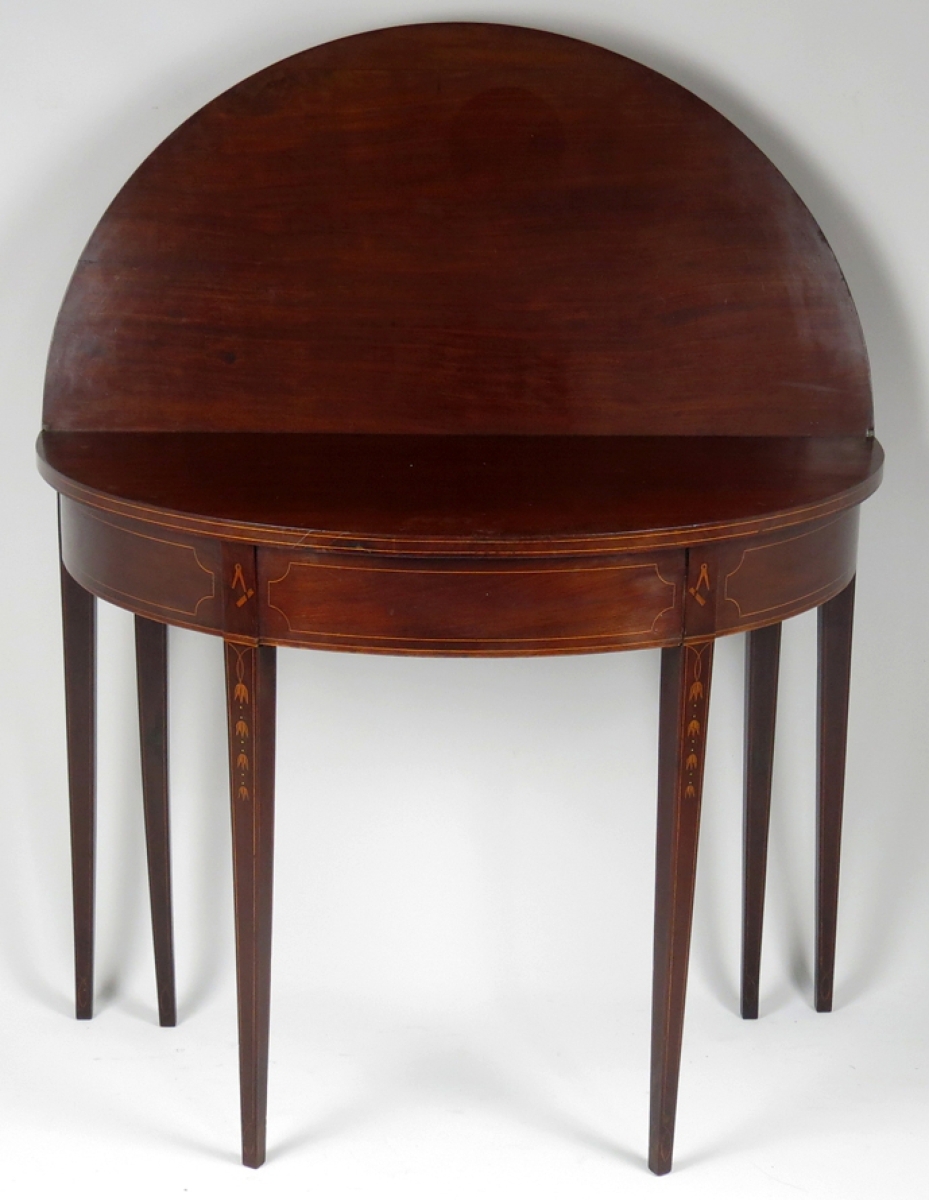 Selling for $10,200, this Newport six-legged, inlaid mahogany card table far exceeded the conservative estimate. It was attributed to the shop of Thomas and Samuel Goddard.