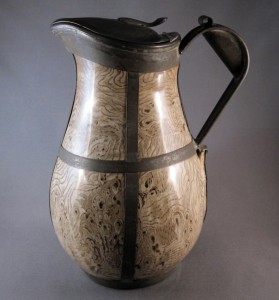 Staffordshire, England, agateware jug with pewter lid and tin replacement handle and bands, mid-Nineteenth Century with later alteration, 8¾ inches tall.