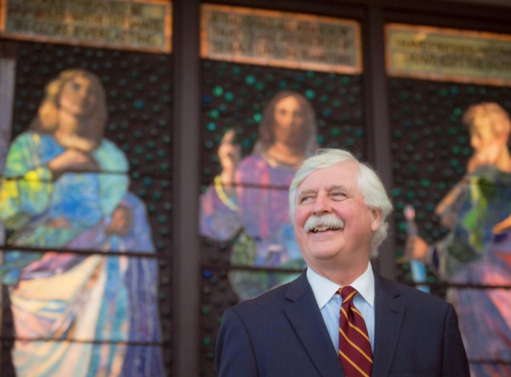 Bill Vareika in front of a John La Farge stained glass triptych, which he and his wife Alison donated to the McMullen Museum of Art, Boston College.