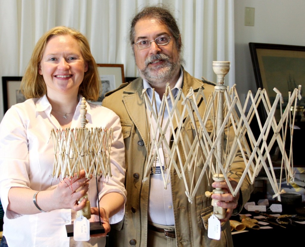 Nantucket dealers Ciara and Jack Fritsch hold Nineteenth Century whalebone swifts.