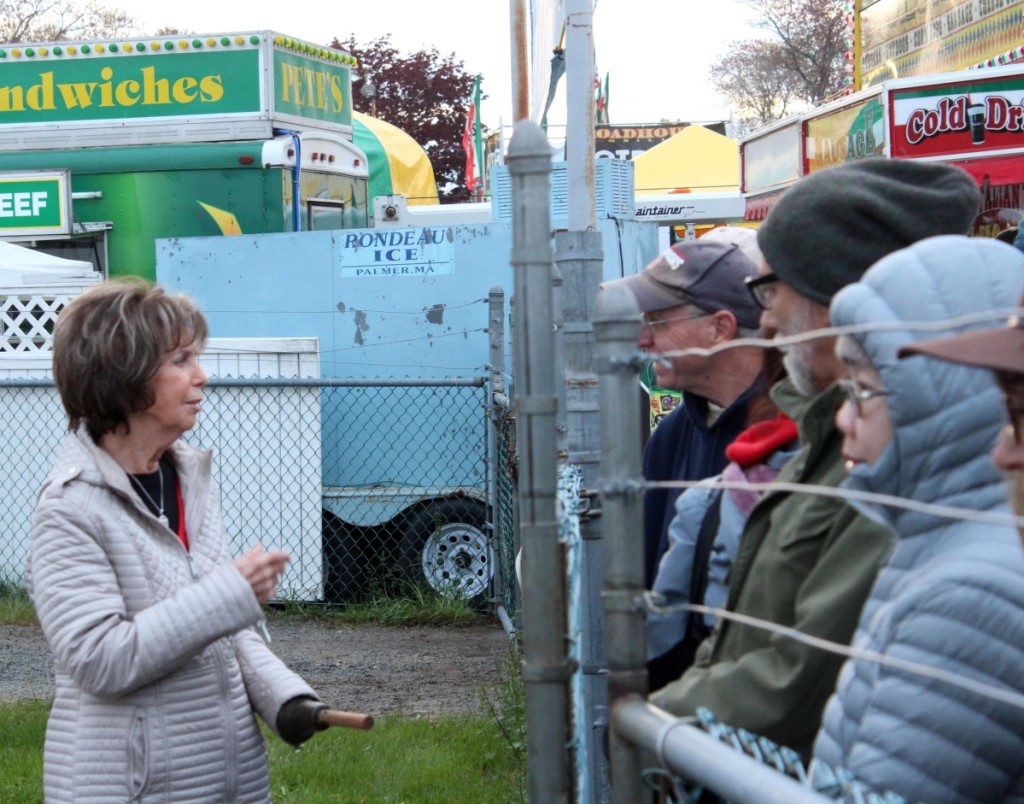 New England Motel co-owner Marie Doldoorian, trademark opening bell in hand, chats with eager shoppers before the gates open promptly at 6 am on Wednesday. The Motel is the first of the day’s three major shows that charge admission.