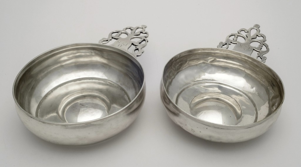 With objects made by silversmith Paul Revere in high demand, forgers were tempted to add fake hallmarks to enhance the value of ordinary pieces. The fake porringer at left, sold by Samuel Harris, had Revere marks added between 1930 and 1950. Compare it to a porringer with genuine marks at right, sold by the American Art Association. Both are from the Wunsch Americana Foundation.