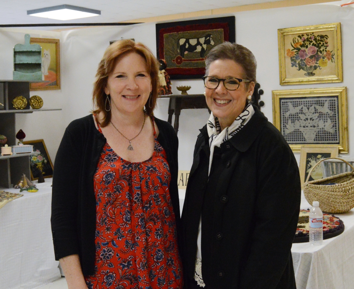 The show’s new show director, Mary-Pat Soucy, left, and Kathy Bach, the Tolland Historical Society’s president (and former show director) take a minute to pose in the booth of Barbara Ardizone, Salisbury, Conn., before the show opened.