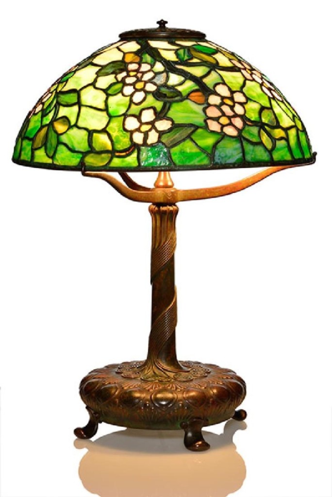 At $22,990, this Tiffany Studios Apple Blossom shade performed well. The bronze base had applied cords that spiraled up the stem, culminating in a 16-inch-diameter shade.