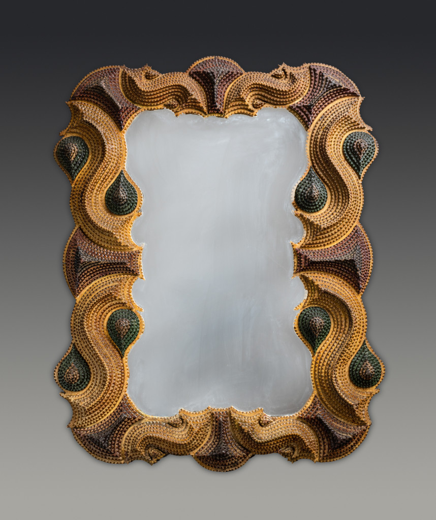 The intricate S-curve patterns of this frame dating to the late Nineteenth or early Twentieth Century are emphasized by varying paint tones. Damiani Family Collection.