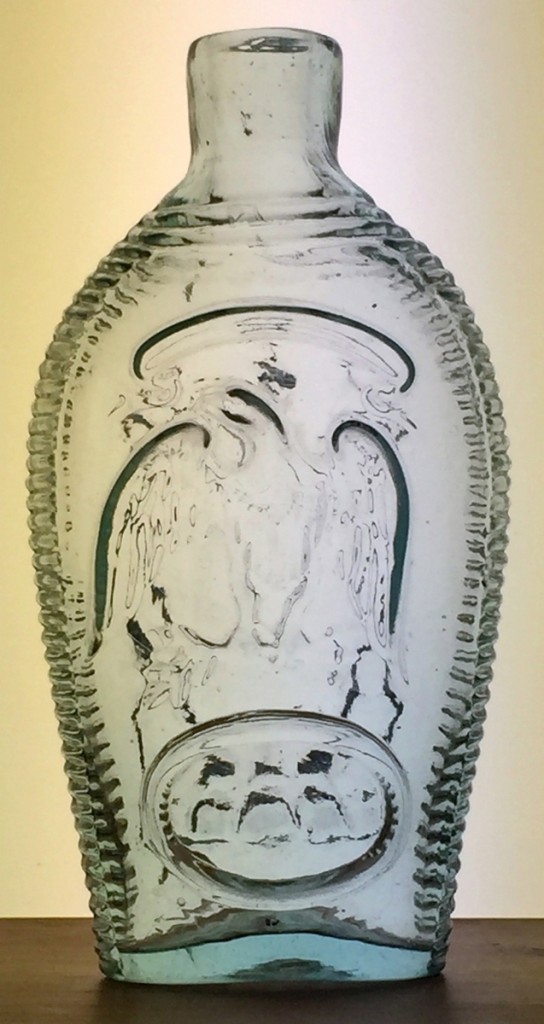 Heckler led with bottles collected by Timothy and Christine Hill. The star piece in the group was this pint flask in aquamarine, $5,265. An eagle decorates the front. A Masonic arch and emblems are on reverse.
