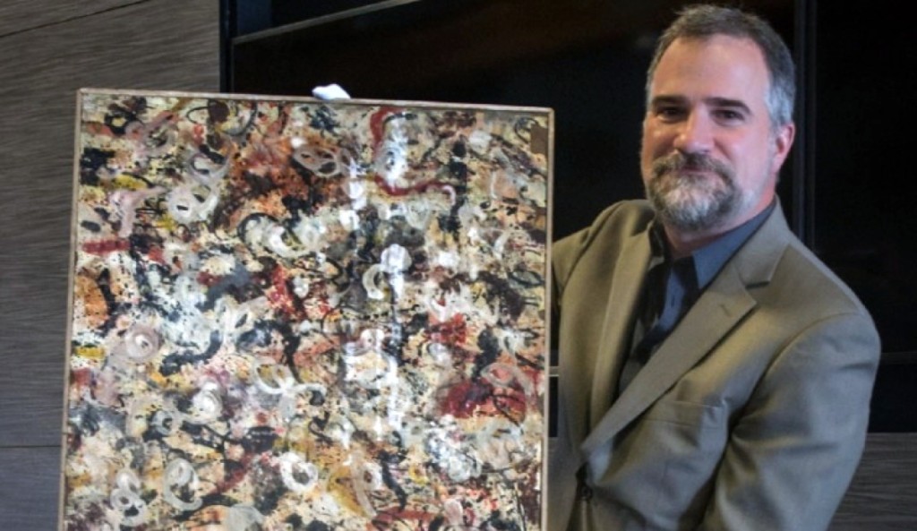 Auction house owner and chief executive officer Josh Levine with rare gouache painting that was found in Arizona garage that was originally scheduled to be auctioned on June 20 in Scottsdale, Ariz.