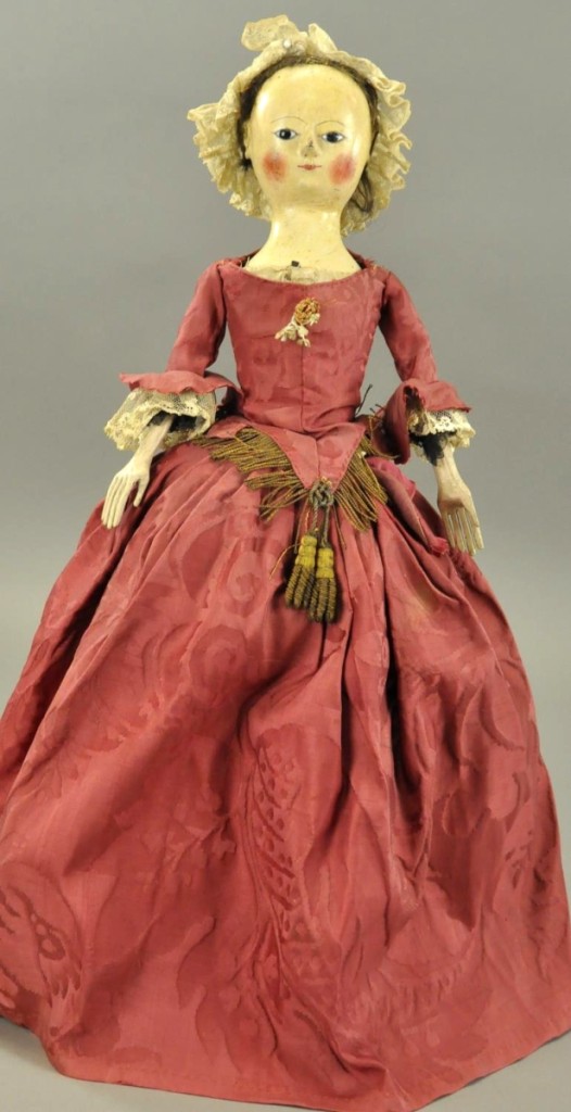 Saturday’s top lot was this Lance English Queen Anne-type wooden doll, late Eighteenth Century with gesso covered and painted head and neck, dark inset glass eyes and wooden arms and legs. She retains remnants of the original hair wig, measures 21 inches tall and has been restyled in period dress. With a high estimate of $3,500, she sold for $19,200.