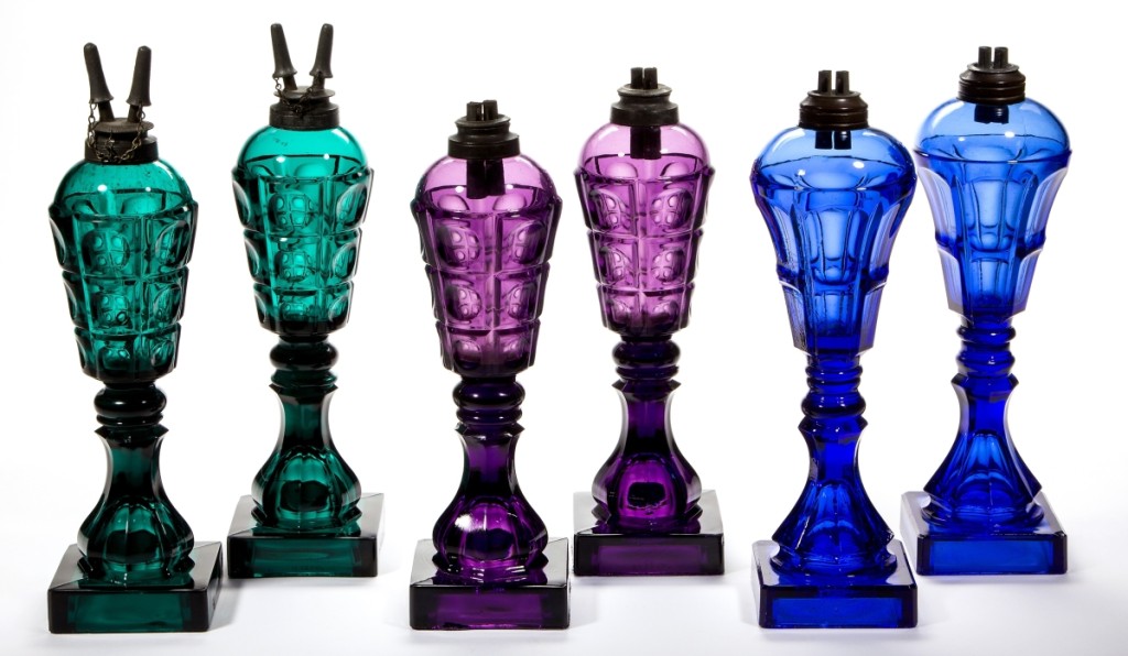 Lighting was the hottest category in the sale, and Joan Kaiser had all the best colors. From left to right, the emerald green lamps brought $10,530; the amethyst pair, $2,574, and the sapphire blue pair, $7,605.