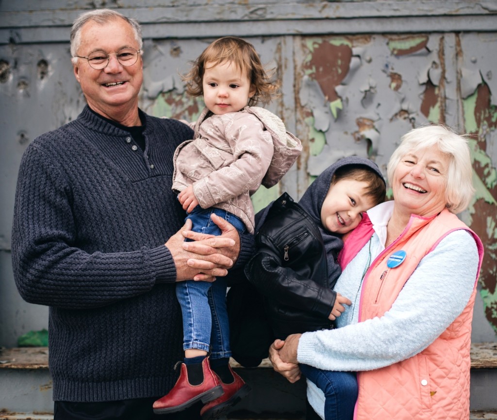 “We make lots of trips to Canada to see our grandchildren, who are in incrediblelittle people,” says Ralph, here holding granddaughter Dylan, nearly 3.In Karen’s arms is grandson Carter, 4.