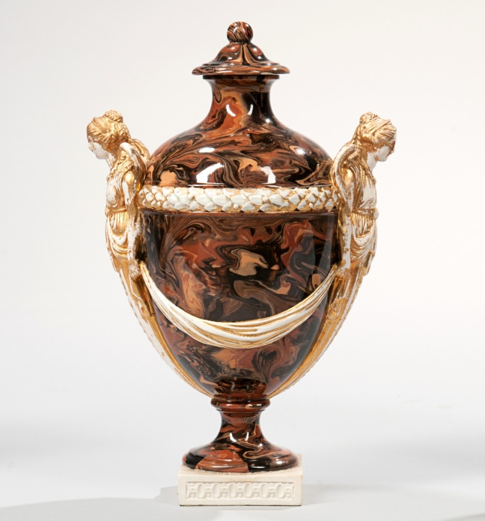 Stuart Slavid had predicted that the Wedgwood agate wares would do quite well and he was right. This Wedgwood & Bentley solid agate vase and cover, circa 1775, earned $10,455, well over the estimate. It had gilding on the glazed white terracotta stoneware angel-form handles and was mounted on a white terracotta base.