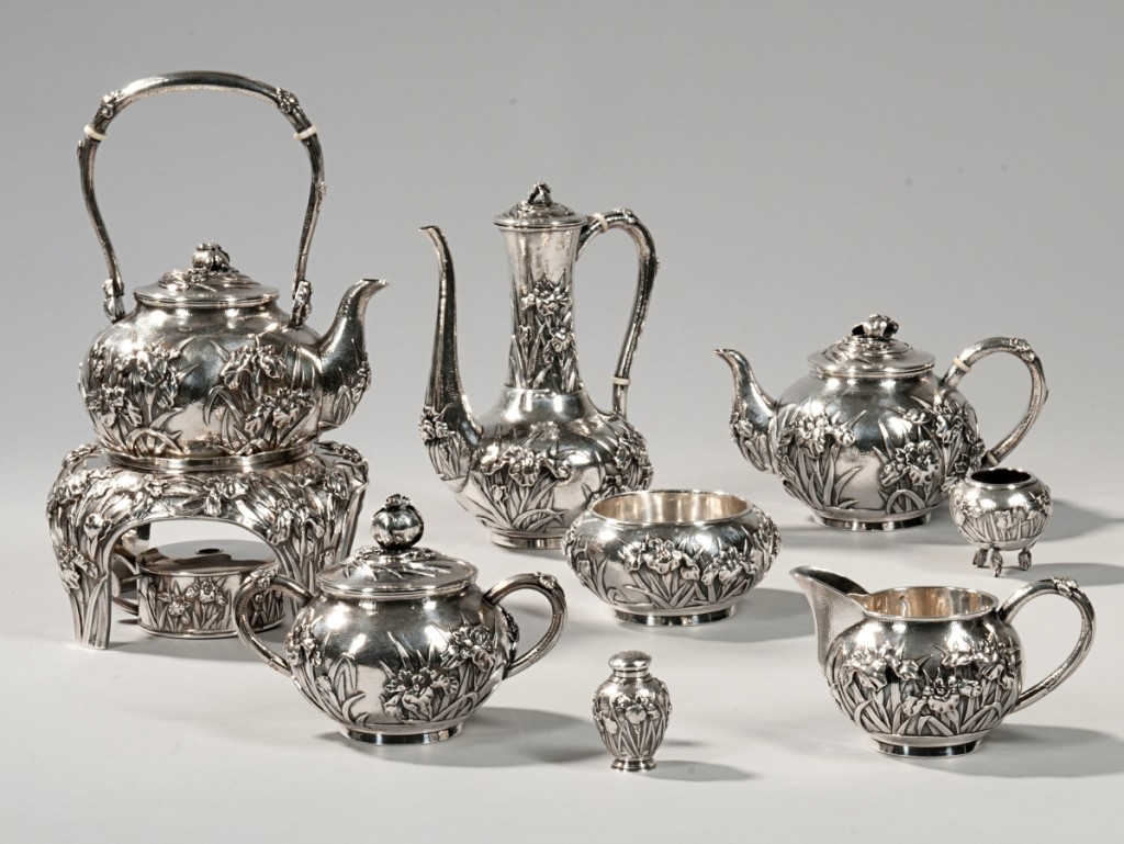 Realizing $14,760, this Japanese tea and coffee service was decorated in the Art Nouveau style with high-relief irises on a hammered ground. It dated to the early Twentieth Century, with each piece bearing the jungin mark. The set weighed 137.7 troy ounces, not including the tray.