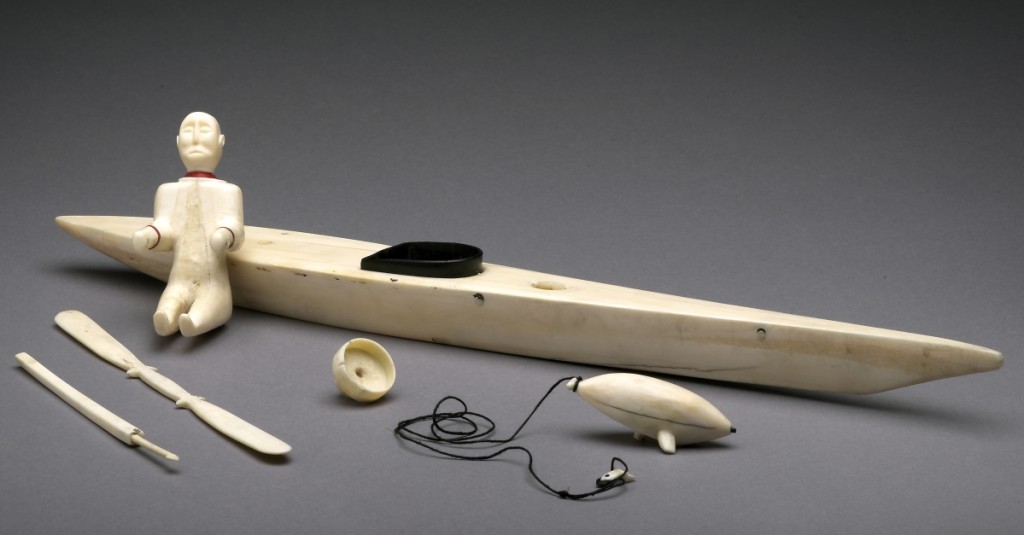 “Man in Kayak,” artist unknown, circa 1900–60. Ivory, red and black plastic, and black thread.