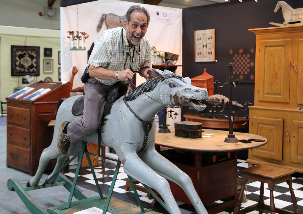 Show manager Frank Gaglio was caught mid-gallop on a Coney Island horse in the booth of Peter Baker.