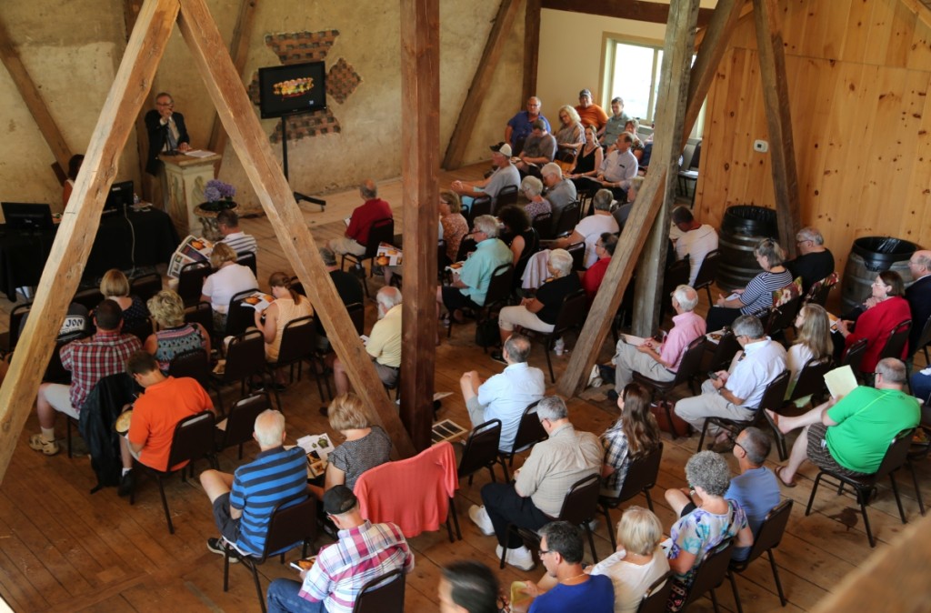 A view from the balcony reveals old beams rising around the packed audience at the Gorsuch Barn.