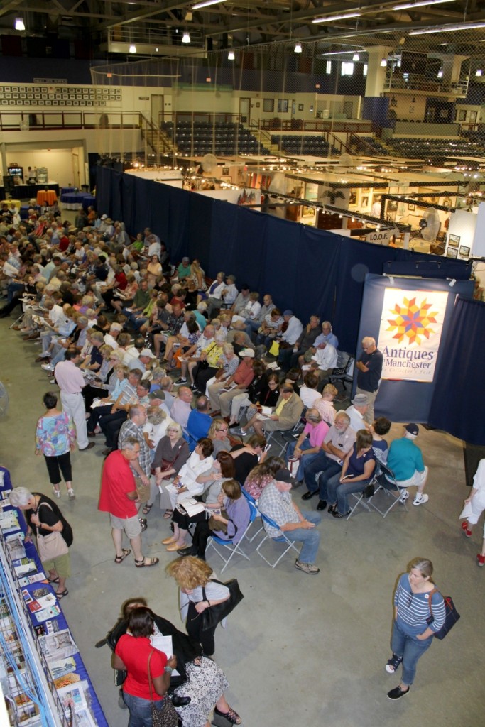 About 15 minutes before the show opens, about 300 people wait anxiously in the “holding area.”