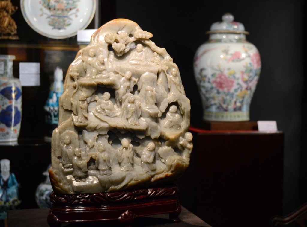 This large Chinese carved jade boulder decorated with lohans, 12 inches tall, and a rare Chinese famille rose porcelain vase and cover vied for attention at Ralph M. Chait Galleries, Inc, New York City.