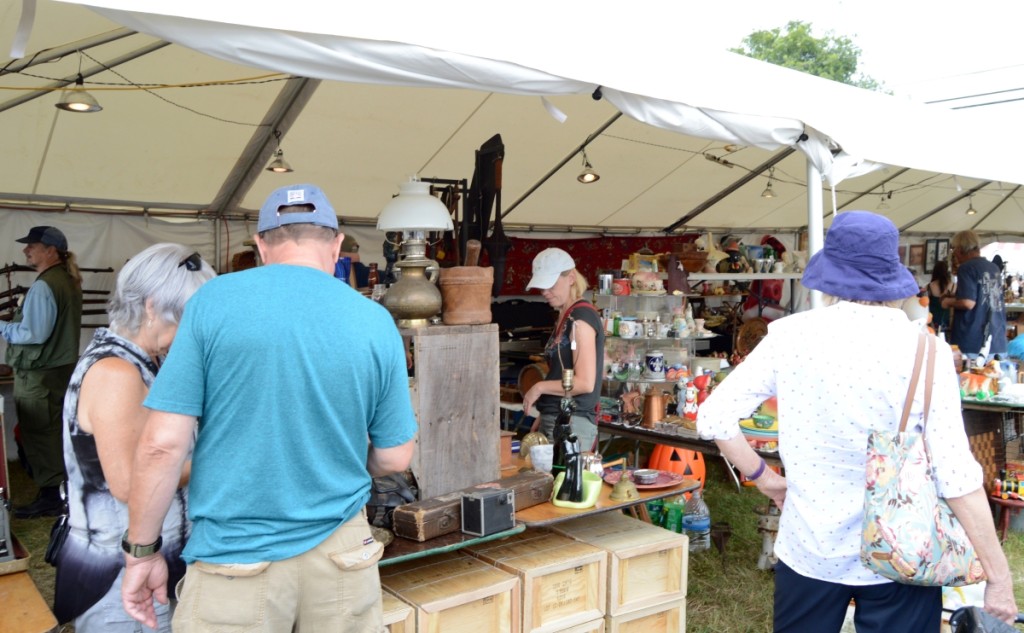 A mix of holiday items, smalls and glass drew buyers into this booth. 			     —Midway Antiques Show