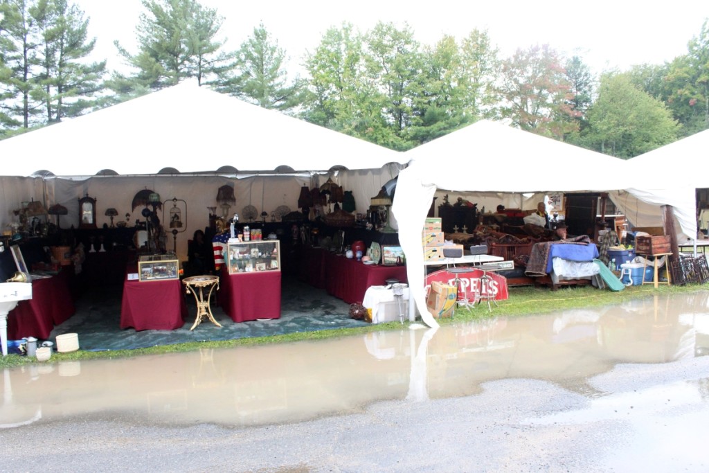 You can see the antiques — but how do you get to them? Puddles galore greeted early shoppers at New England Motel.