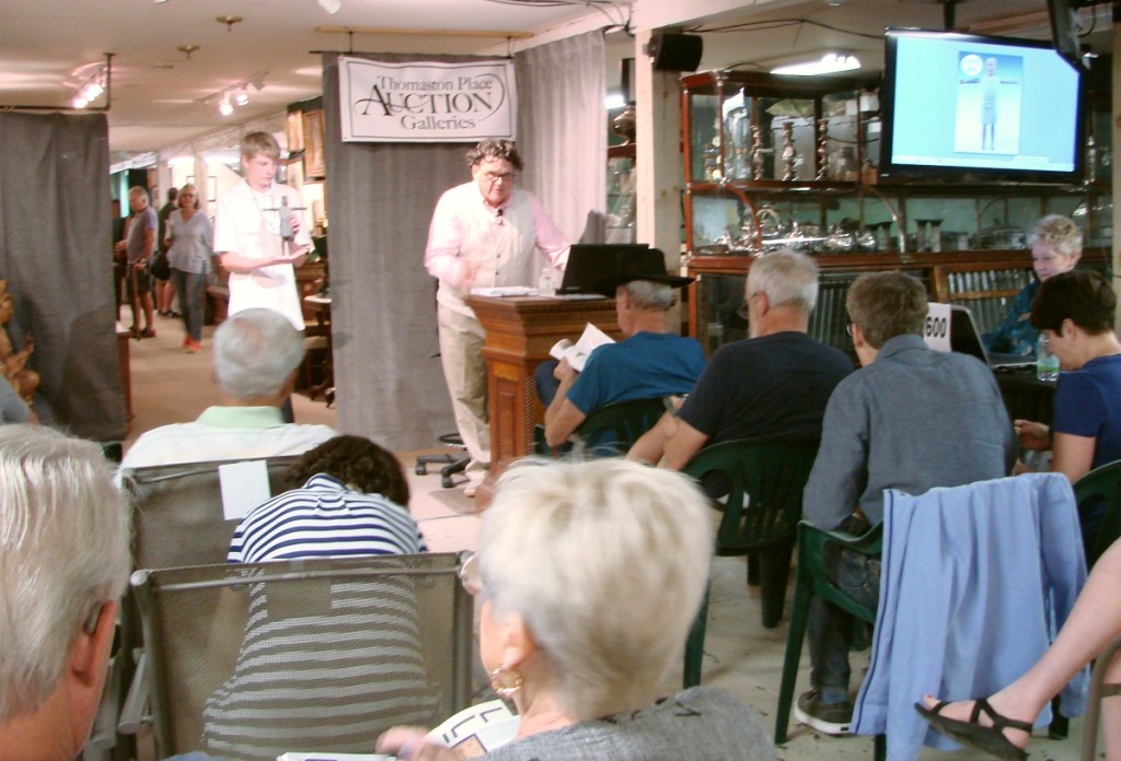 Kaja Veilleux sells the first lot of the second day of the sale, a whirligig of a Native American.