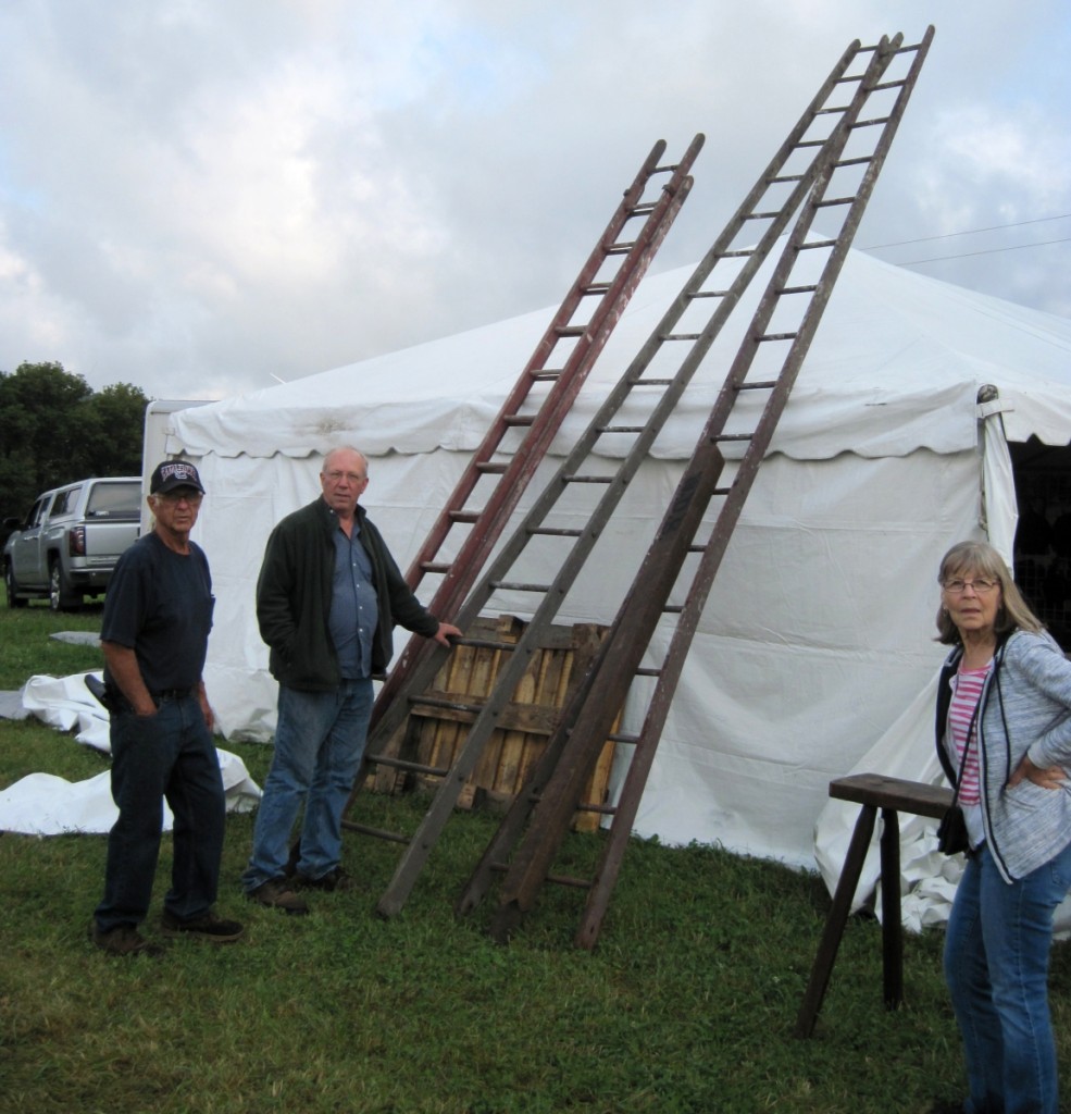 Richard Fuller considers the apple picking ladders offered by Don and Jane Desjardins.