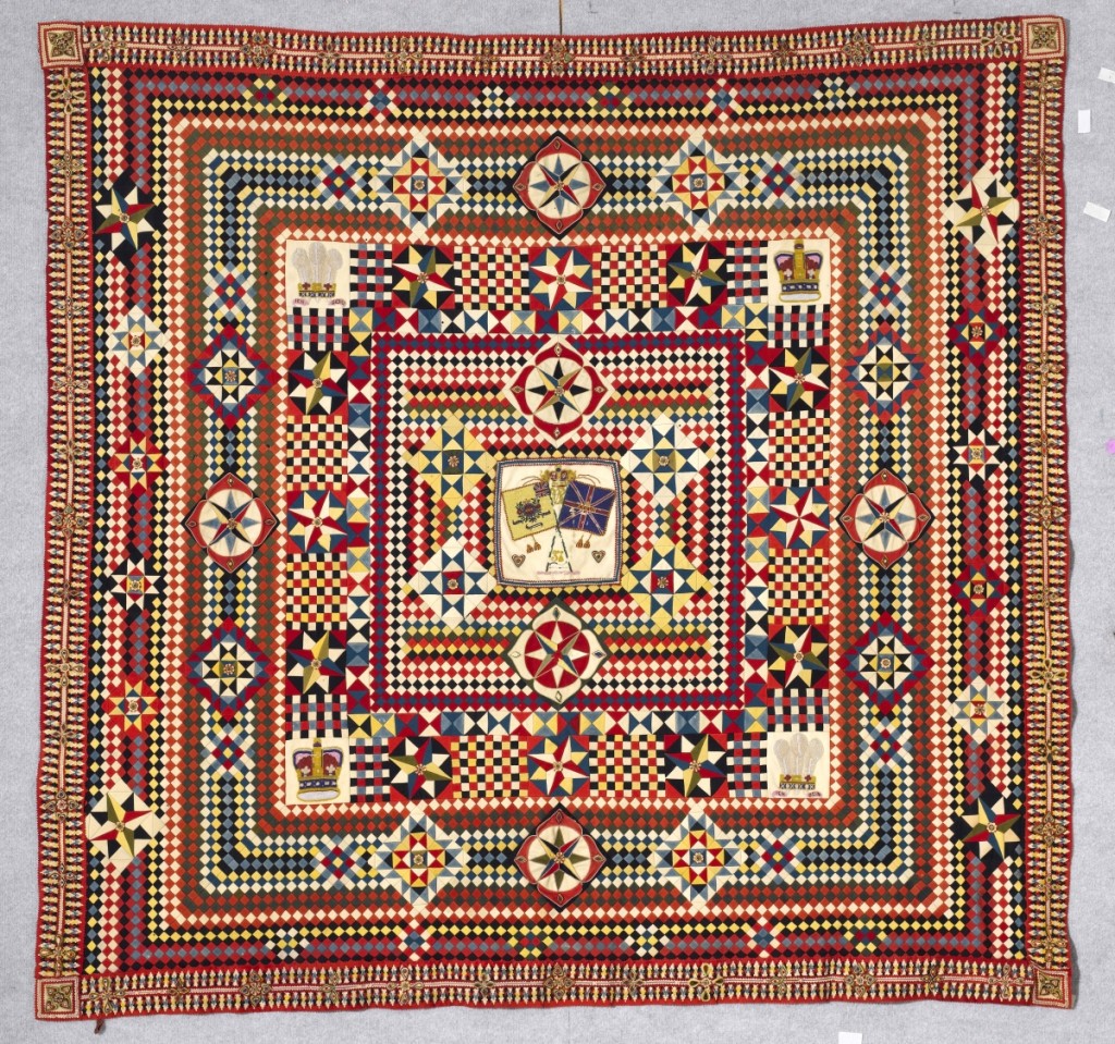 Soldier’s quilt with incredible border, artist unidentified, India, circa 1855–75, wool from military uniforms, with beads, hand applied beadwork and layer-appliquéd border, 82 by 85 inches; The Annette Gero Collection. —Tim Connolly, Shoot Studios photo