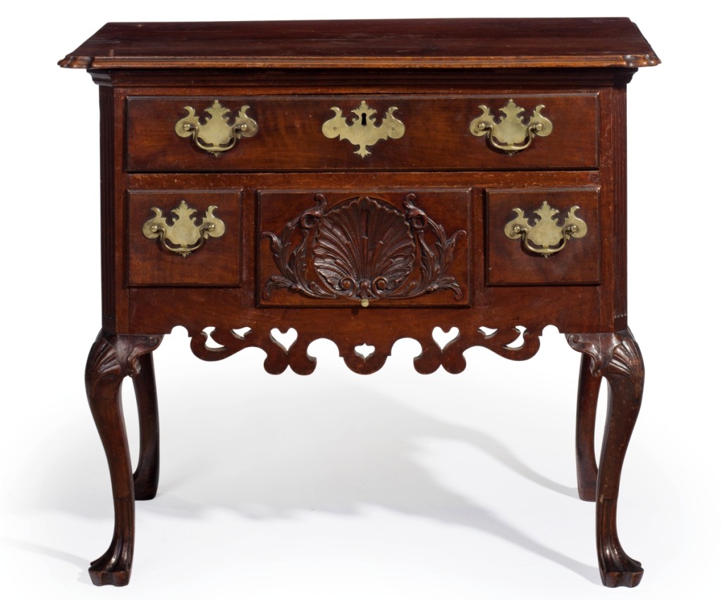 This Philadelphia Queen Anne carved walnut dressing table from the Rosebrook collection brought $106,250 ($30/50,000). The case is attributed to the shop of Henry Clifton (d 1771) and Thomas Carteret, with carving attributed to Nicholas Bernard (d 1789), 1750–60.