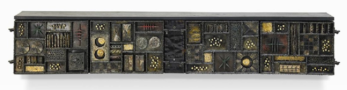 The top lot of the sale was this 98½-inch sculpture front cabinet by New Hope maker Paul Evans that rang in at $200,000. It was one of the longer cabinets produced by the artist and sits as the sixth highest result that Rago has produced for an Evans work.