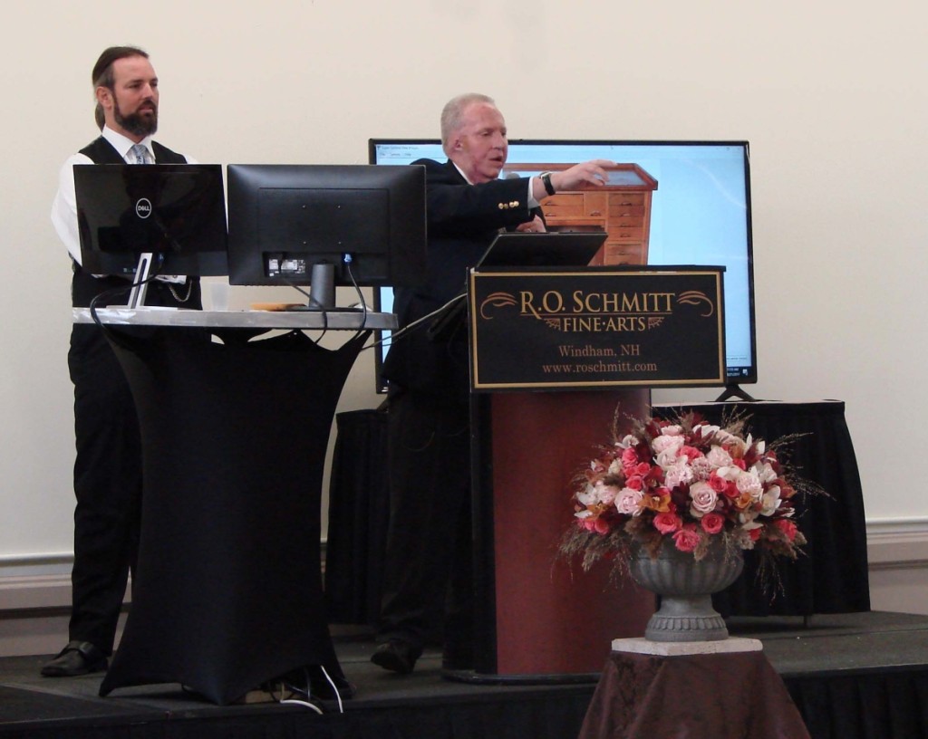 On the left is Dan Horan and at the podium is Robert Cheney, well-known and respected authority on clocks, who is now part of the firm.