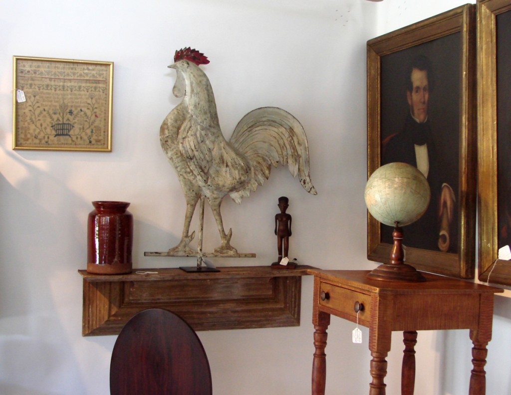 The full-bodied rooster weathervane with old white paint was in the booth of Dennis and Valerie Bakoledis, Rhinebeck, N.Y.