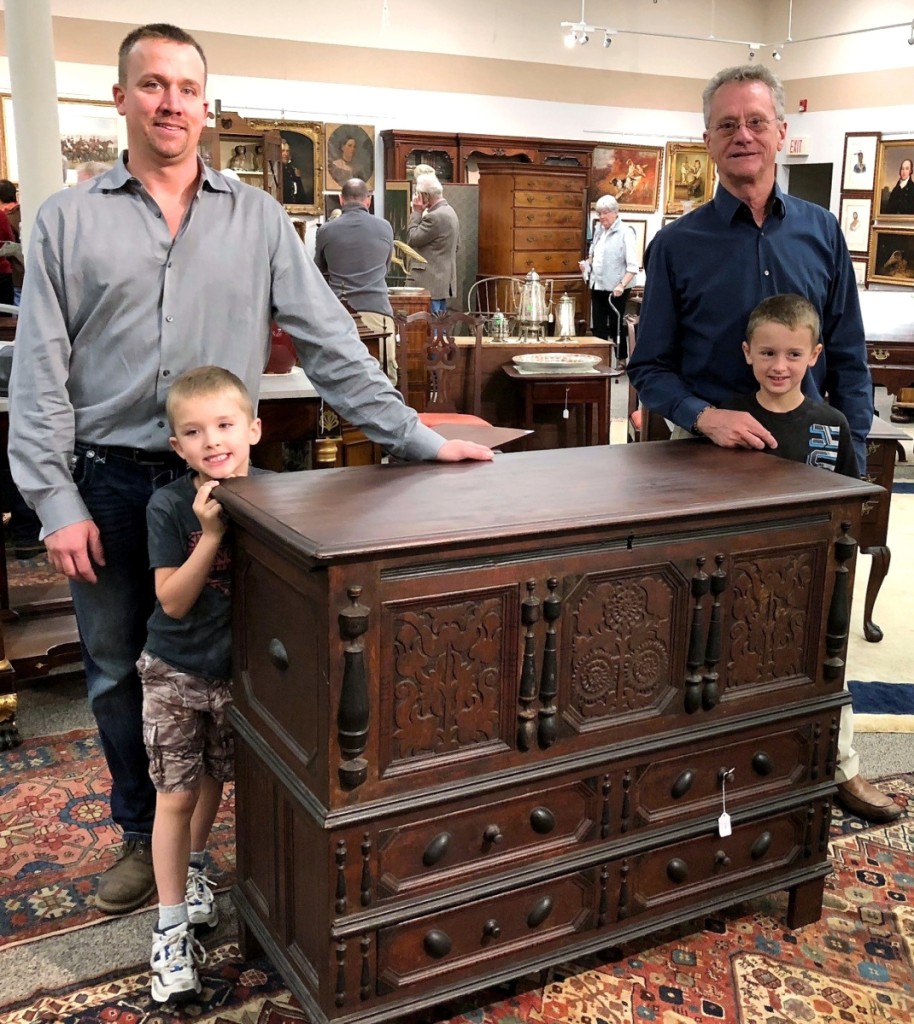 Ask for Ed, Eddie, Edwin or E.J., and three out of four of these gentlemen will respond. Auction house founder and patriarch Edwin Nadeau Jr, right, is assisted by his son Edwin J. Nadeau III. Grandsons E.J. — that’s for Edwin J., naturally — and Zack will be runners soon. The family is shown with the sale’s top lot, $32,400, a Sunflower chest attributed to Peter Blinn of Wethersfield, Conn. The piece has a long history of descent in Connecticut’s Foote, Otis, Brainerd and Bulkeley families.