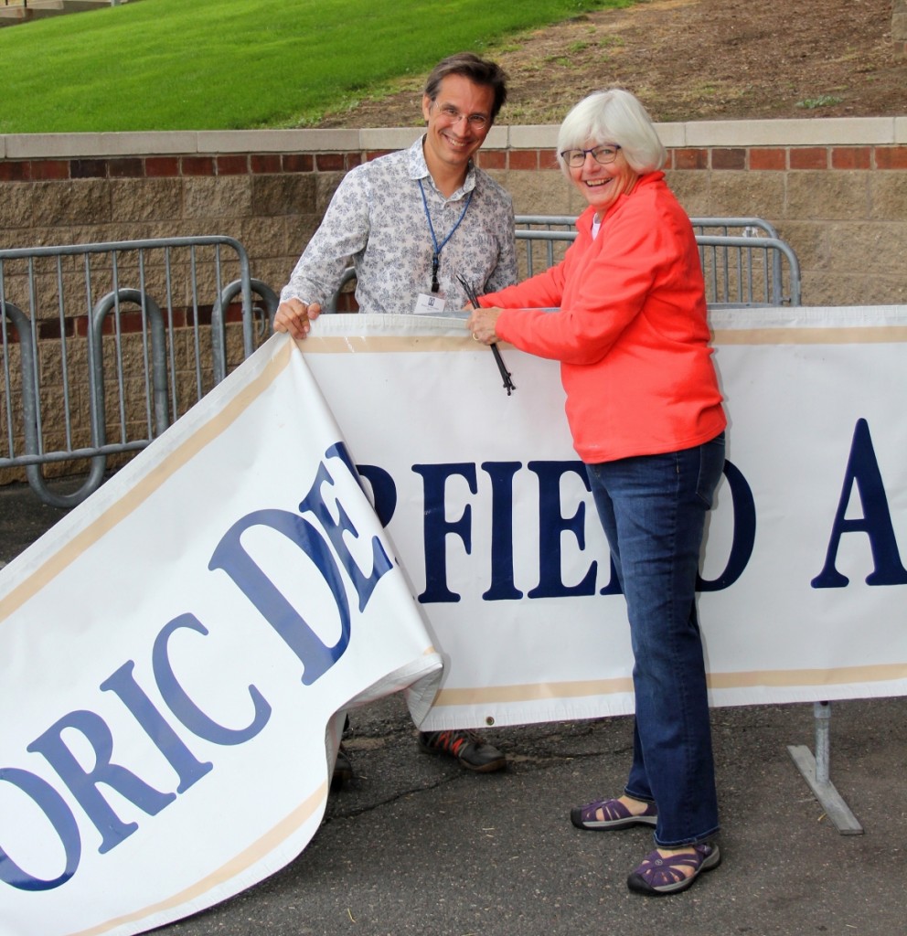 ADA president Steve Powers and show manager Karen DiSaia attended to last-minute details, such as hanging up the ADA Historic Deerfield Antiques Show banner.