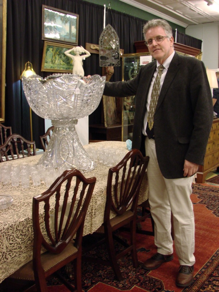 Gallery director Dan Meader with the unique cut glass punch bowl that he discovered on a house call.