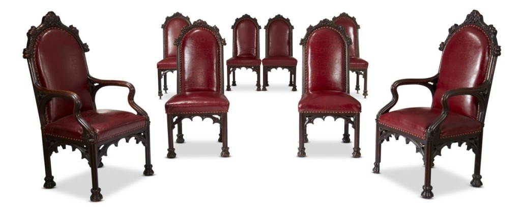 The rare set of 14 Herrick-Maynard-Hatch Gothic Revival carved oak dining chairs, designed by architect Alexander Jackson Davis (1803–1892) for Ericstan, included this lot of eight chairs that went out at $81,250.