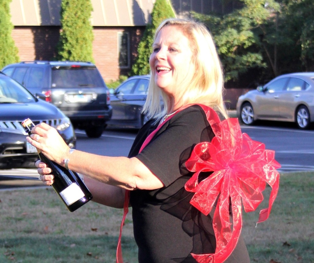 Sandra Germain, co-owner of Shannon’s Fine Art Auctioneers, popped the cork in celebration of her firm’s new quarters.