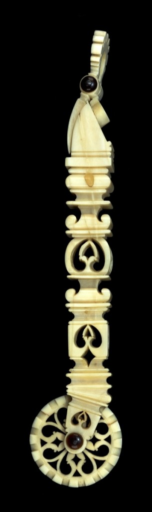 An extraordinarily detailed whale ivory pie crimper, which had the same elaborate reticulated design on all four sides of its square shaft, sold for $39,000.