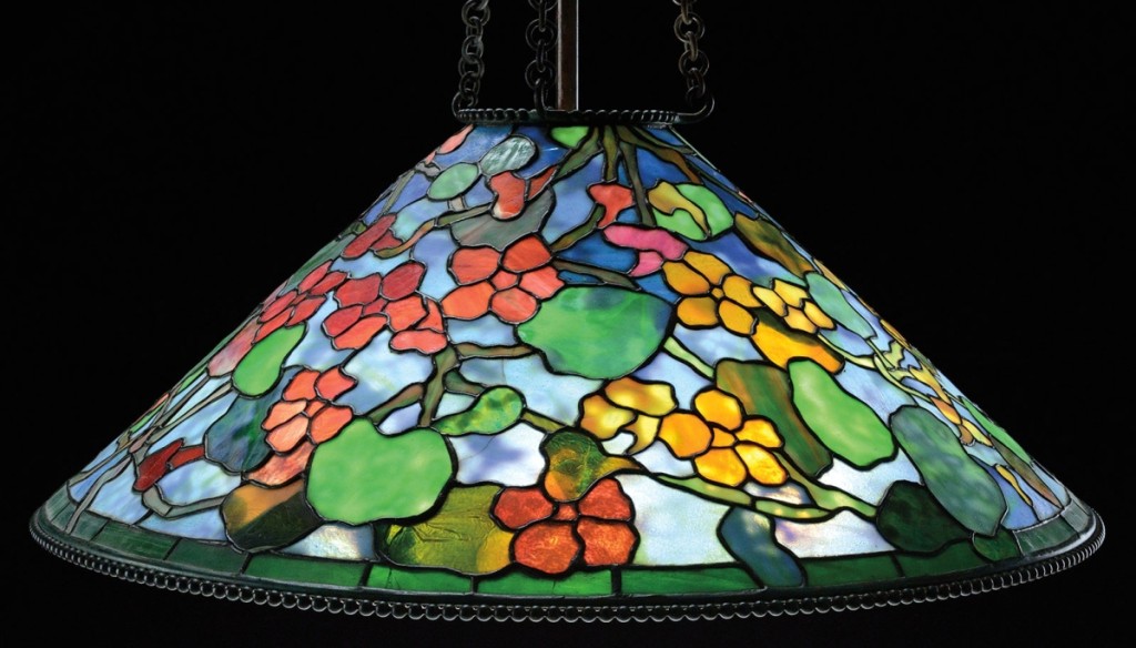 Also bringing $84,700, this signed Tiffany Studios 16-inch Rose and Butterfly table lamp had yellow roses and red butterflies over the roses.