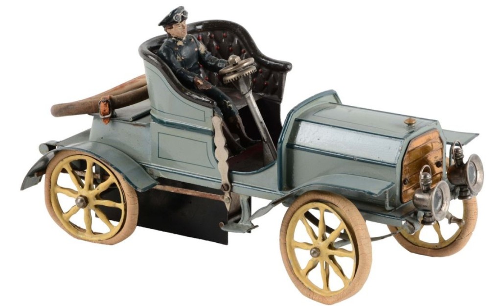 There were a number of extremely high-quality German cars in this sale, and this one, a Marklin hand painted open two-seat roadster, was the best. It was the top lot in the sale at $90,000 as a floor bidder stuck it out against competing phone lines. It was circa 1905 and all original, with open rear tool compartment, leather strapped-down rubber spare tire, nickel finished lamps, driver and clockwork mechanism.