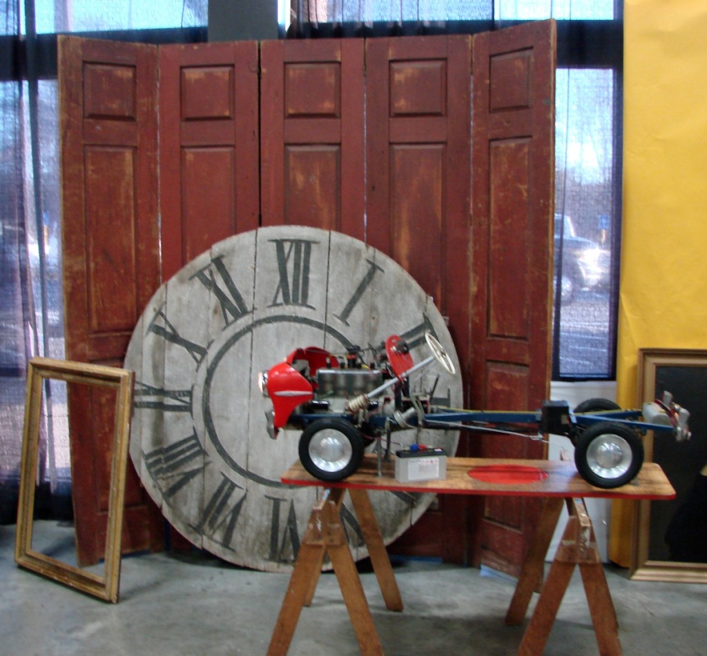 The large clock face was in the booth of Don Heller and Kim Washam, Portland, Maine. It was 56 inches in diameter and came from a circa 1850 tower clock in Cleveland, N.Y. It was priced at $2,600. The driving school model car, with operating details, dated about 100 years later and was priced at $5,300.