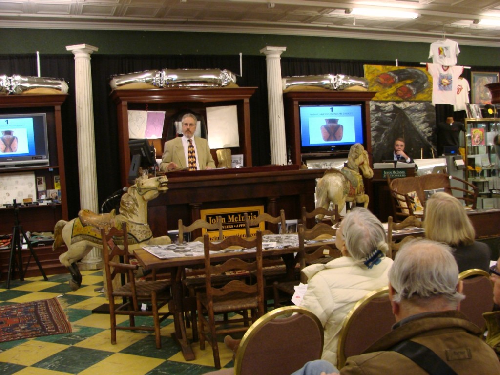 John McInnis shown here going over terms of the sale prior to selling lot #1