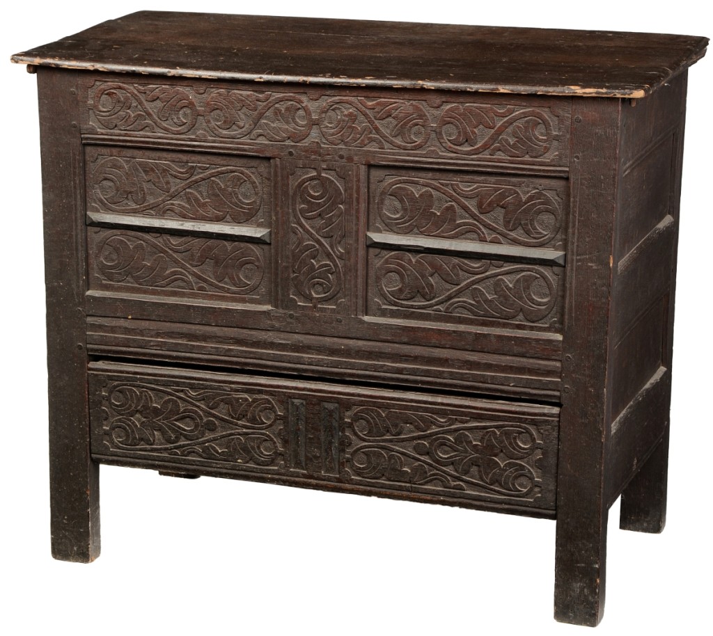 This rare New England Pilgrim Century carved chest, attributed to Guilford, Conn., reached the top price of $168,000.