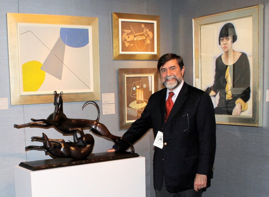 Eric W. Baumgartner, senior vice president and director of American paintings and sculpture at Hirschl & Adler Galleries, with “Greyhounds Playing” by Hunt Diederich, circa 1920–25. On the wall, center and right, works by Paul Kelpe and Winold Reiss.