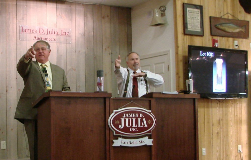 Jim Julia at the podium with Chief Executive Officer Mark Ford assisting.