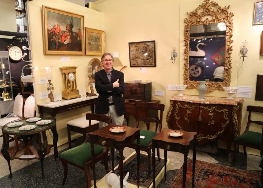 Paul Thien of Firehouse Antiques, Galena, Md., stands in his booth of formal American and continental furniture. The dealer is representing a fine collection that was amassed in the 1920s and 1930s, saying the quality was some of the best he has ever exhibited.