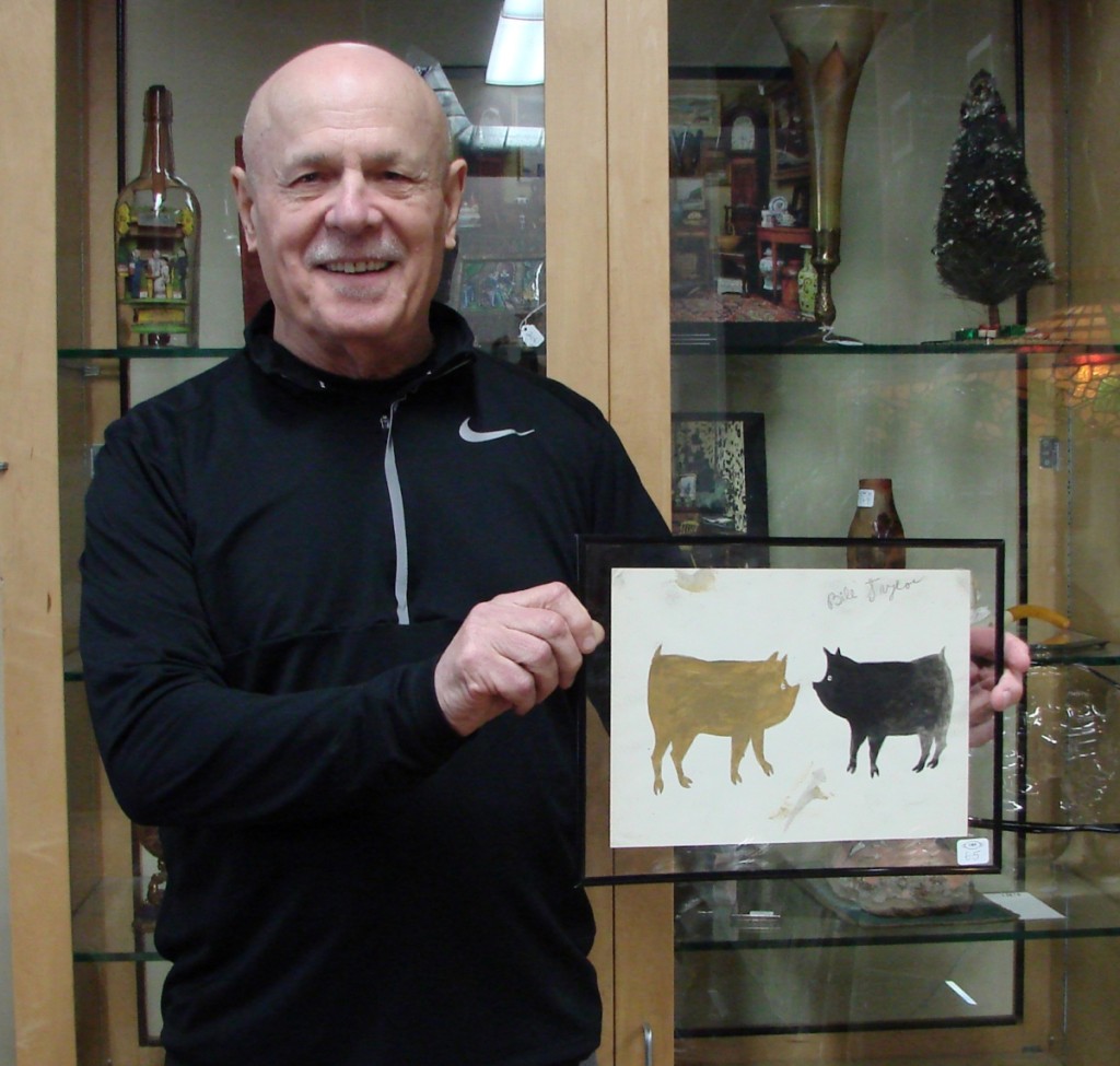 Carl Nordblom with the Bill Traylor watercolor that brought the highest price of the sale.