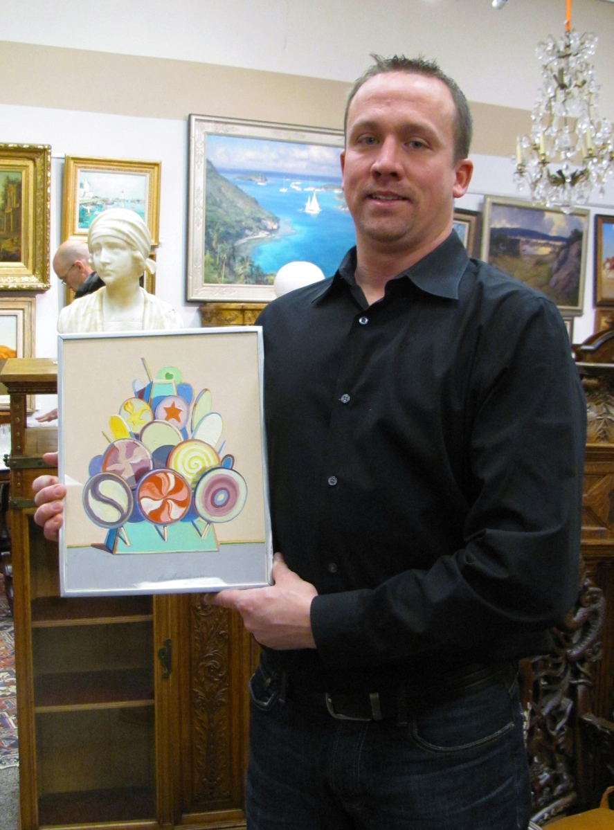 Eddie Nadeau is shown before the sale holding the sale’s top lot, “Lollipop Tree” by Wayne Thiebaud. It surpassed even the firm’s expectations.