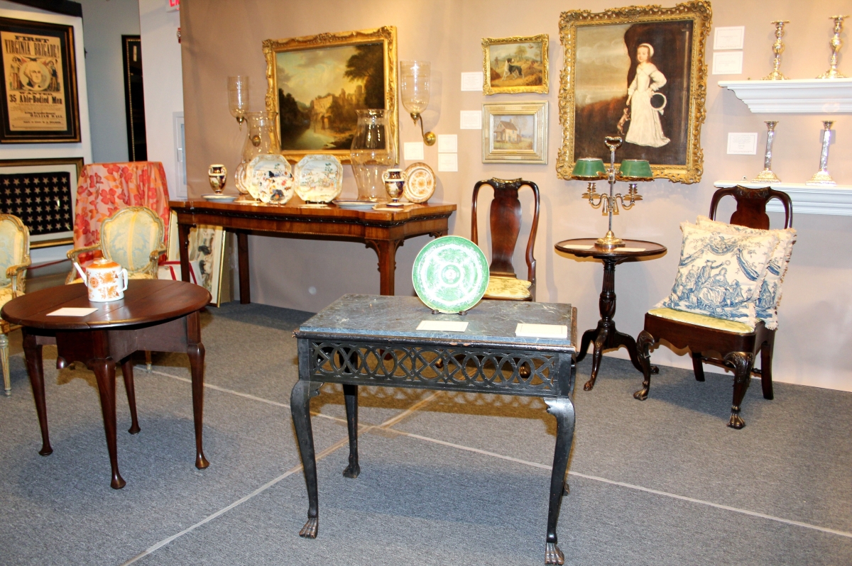 James M. Kilvington, Greenville, Del. In the foreground, the Irish slab-top table with a pierced skirt and brush feet dates to about 1750.