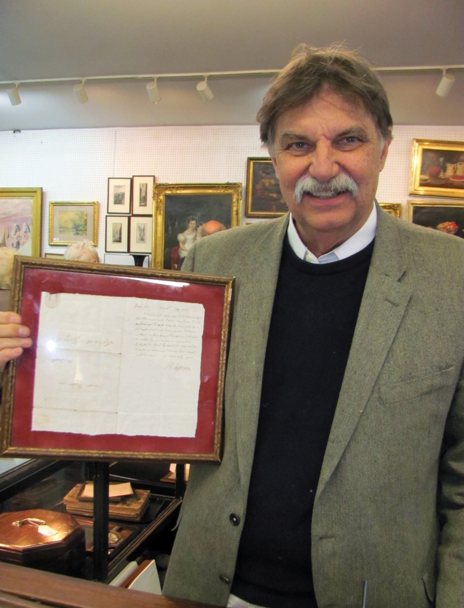 Russ Carlsen holding the Thomas Jefferson handwritten autograph letter that brought the third highest price in the sale at $8,775 ($2/4,000).