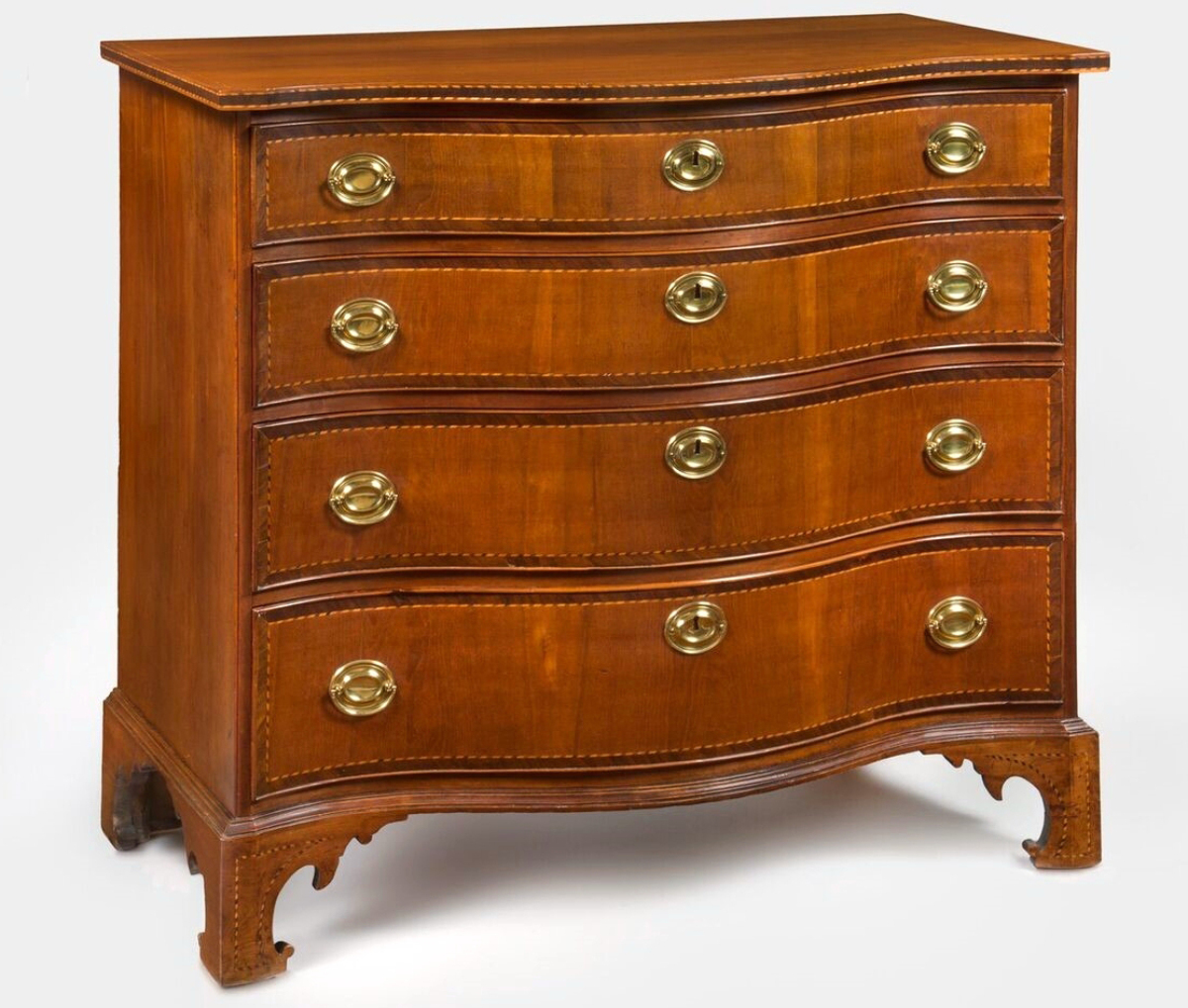 Serpentine chest of drawers by Nathan Lumbard. Inscribed “Made by Nathan Lumbard Apl 20th 1800.” Cherry, cherry and mahogany veneers, light and dark wood inlays, white pine; height 37 by width 41-  by depth 21¾ inches. Private collection.   				                 —Gavin Ashworth photo
