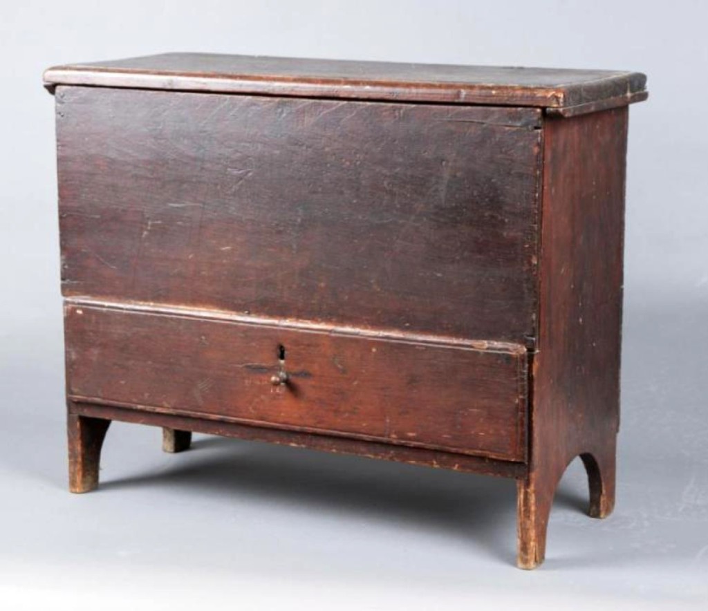 There was a lot of presale interest in this early miniature blanket chest in old red paint. It was 21 by 27 inches, had one drawer and sold for $3,840. Five phone bidders competed.